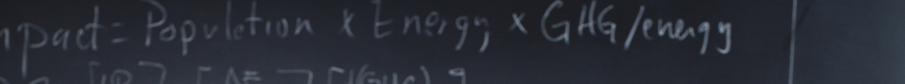 Blackboard with formulas written in chalk