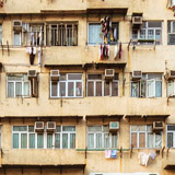 Energy-hungry air conditioners in a Hong Kong apartment building.