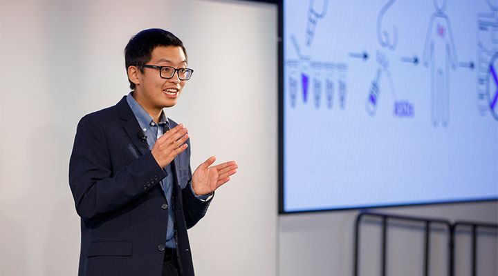 Justin Lee delivering his winning talk at the 2022 UC Grad Slam