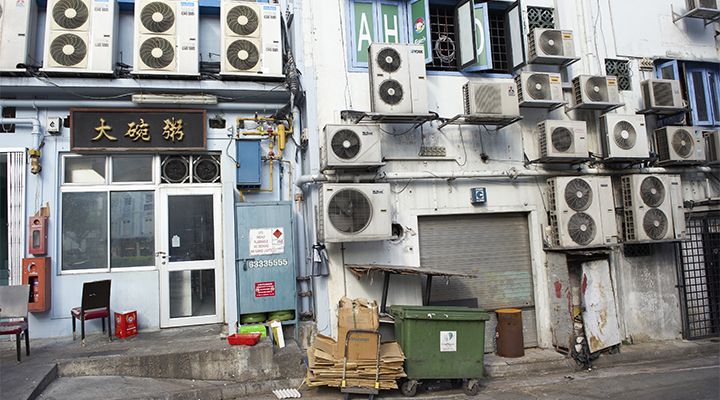 An image of air conditioners on a building in Asia