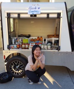 Diana Lee in front of the Mobile Pop-Up Pantry