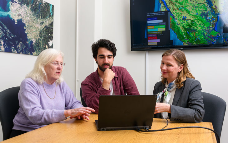 PhD Student Eric Romero with Professor Iryna Dronova and Kass Green at UC Berkeley’s Geospatial Innovation Facility