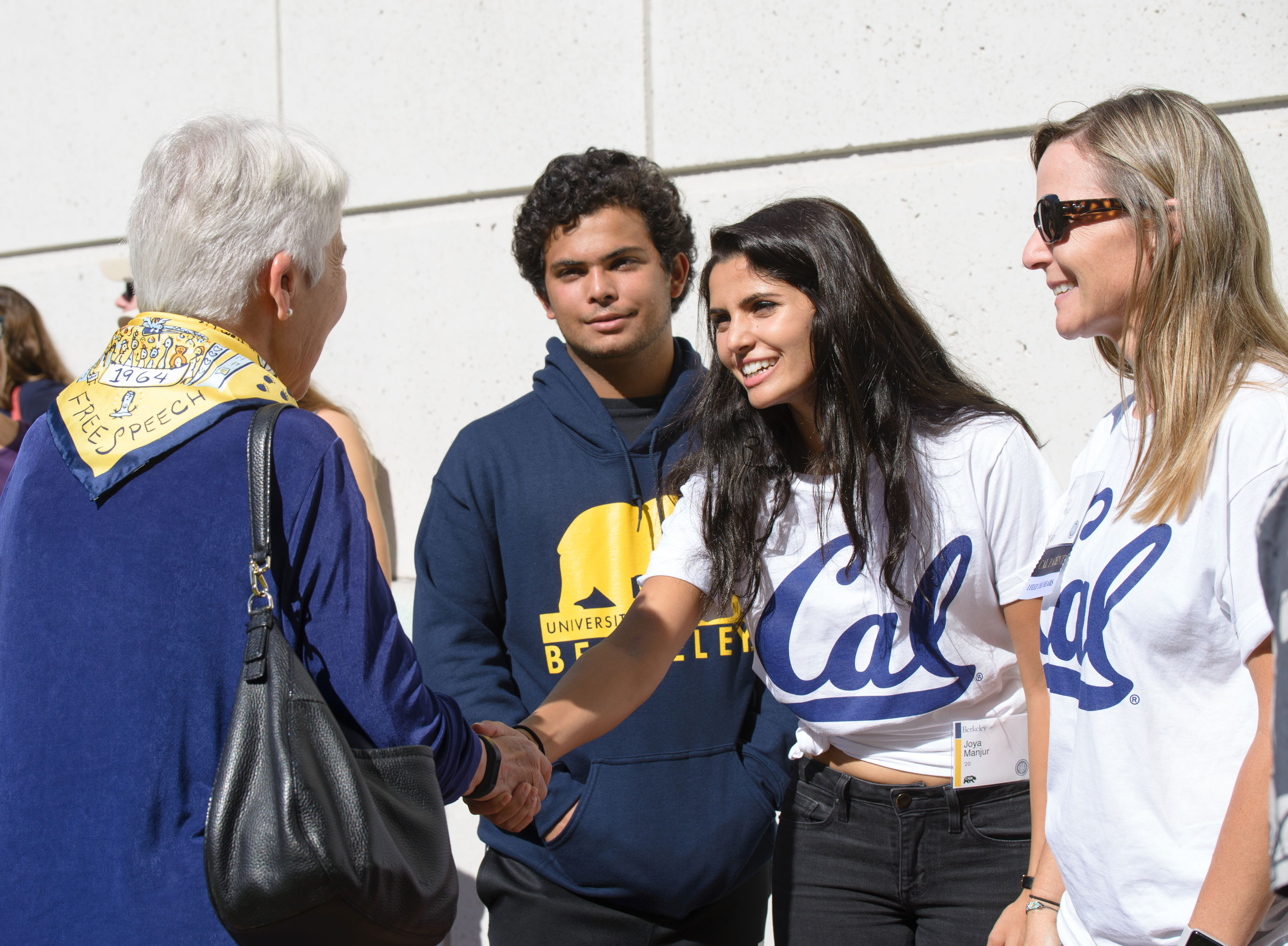 Cal student shaking hands with Chancellor Carol Christ