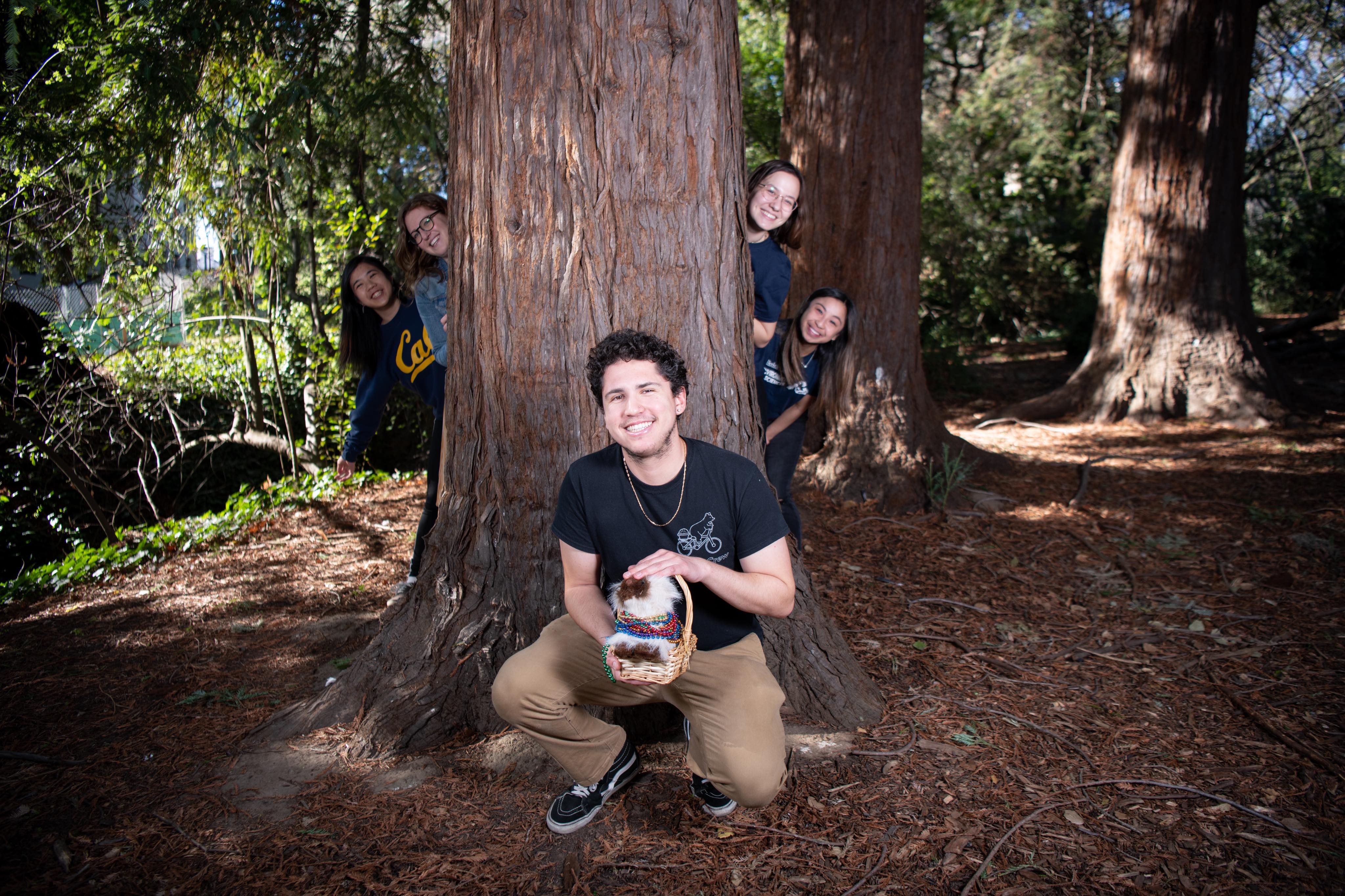 Dante Gonzalez sitting in front of a tree.