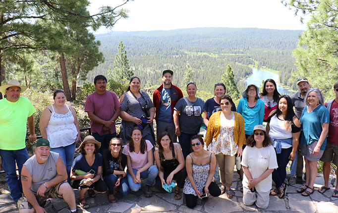 Klamath River Basin project team poses near Klamath River as a group