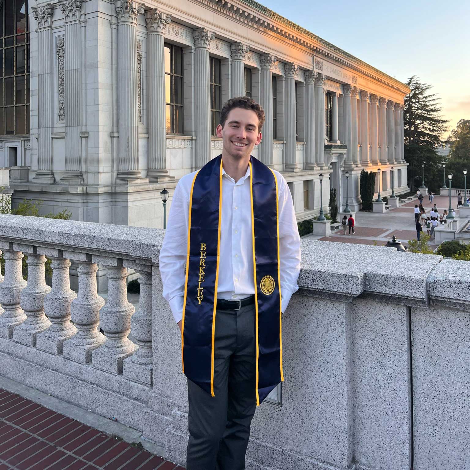 Dan Willett graduation photo with Doe Library