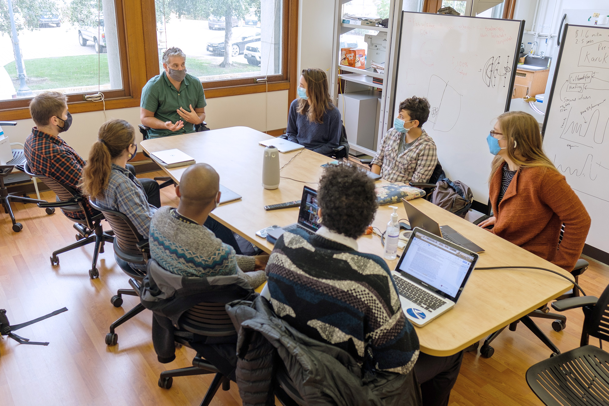 Students sitting at a table in a lab.