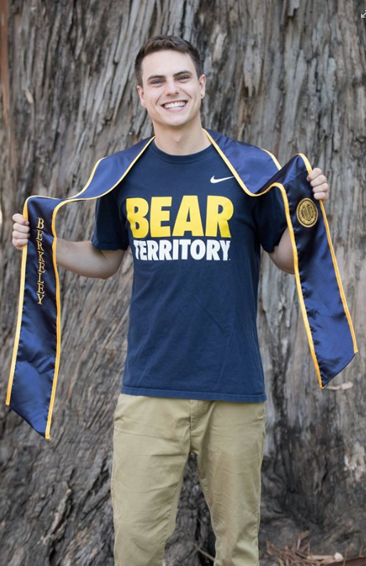 Brian wearing a "Bear Territory" shirt and his graduation stole.