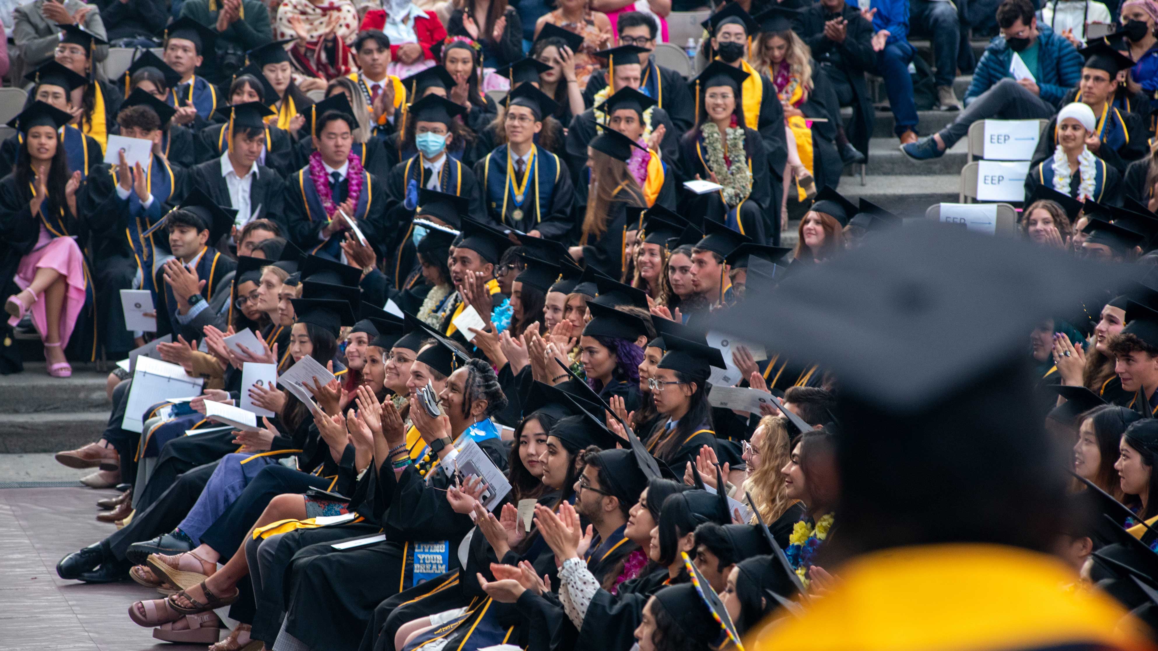 A large group of graduates at a commencement