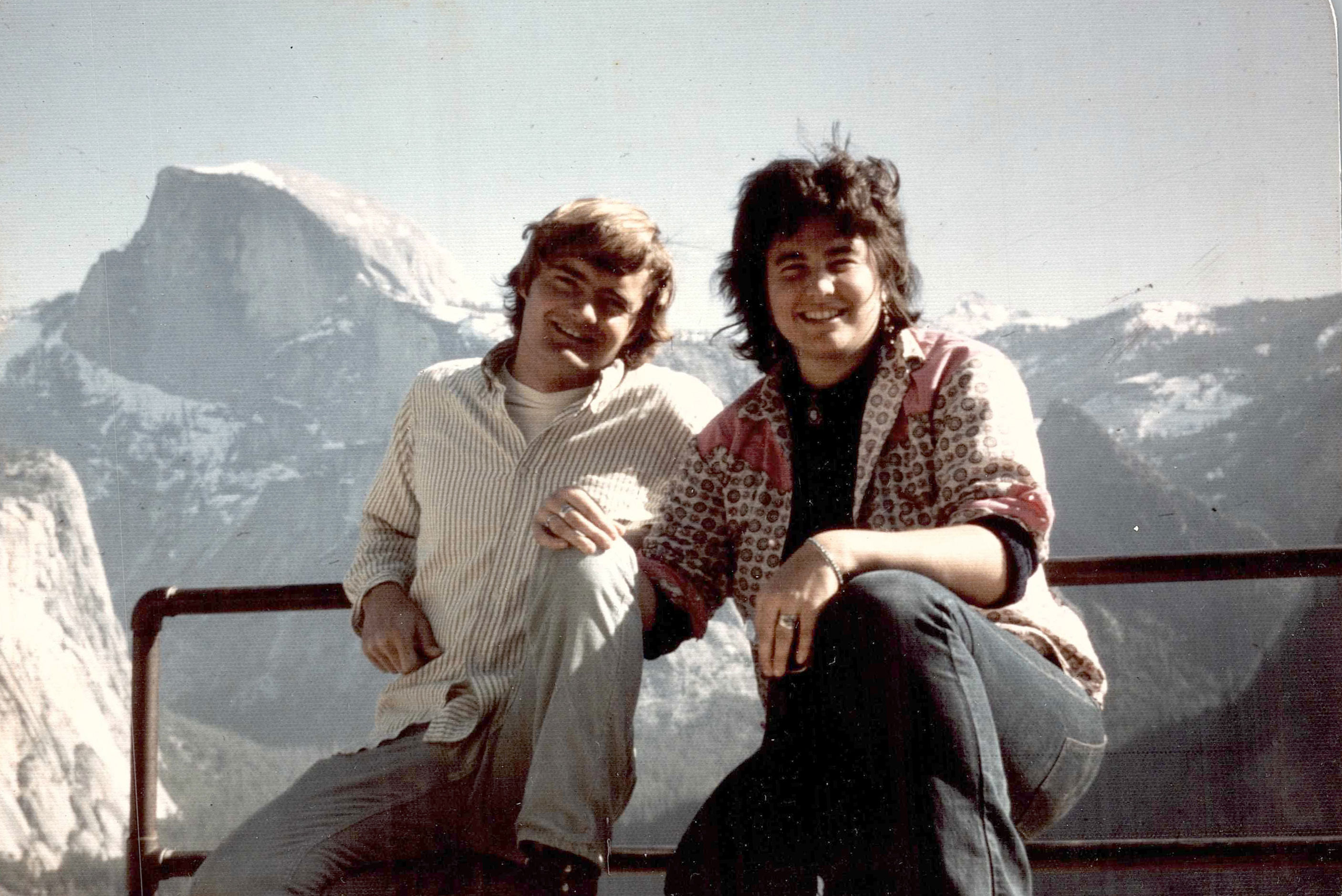 And old photo of two young people in front of half dome in Yosemite