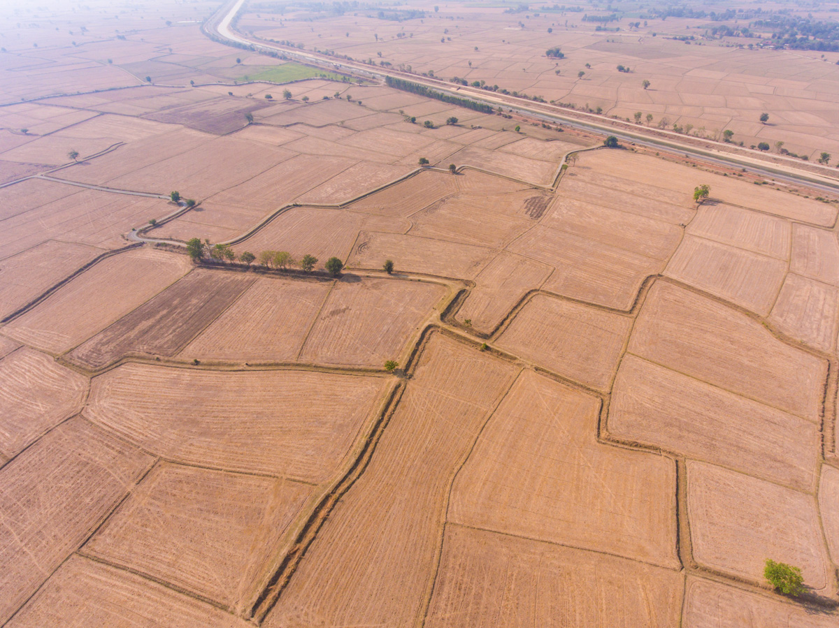 An aerial photo of dry farmland in various plots