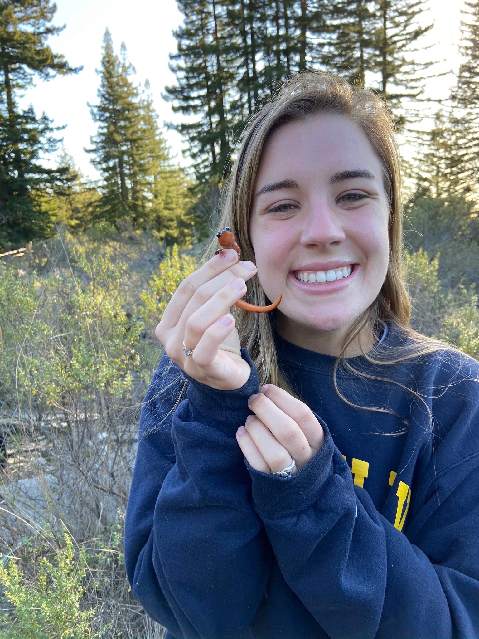 Aileen Lavelle holding a red salamander.