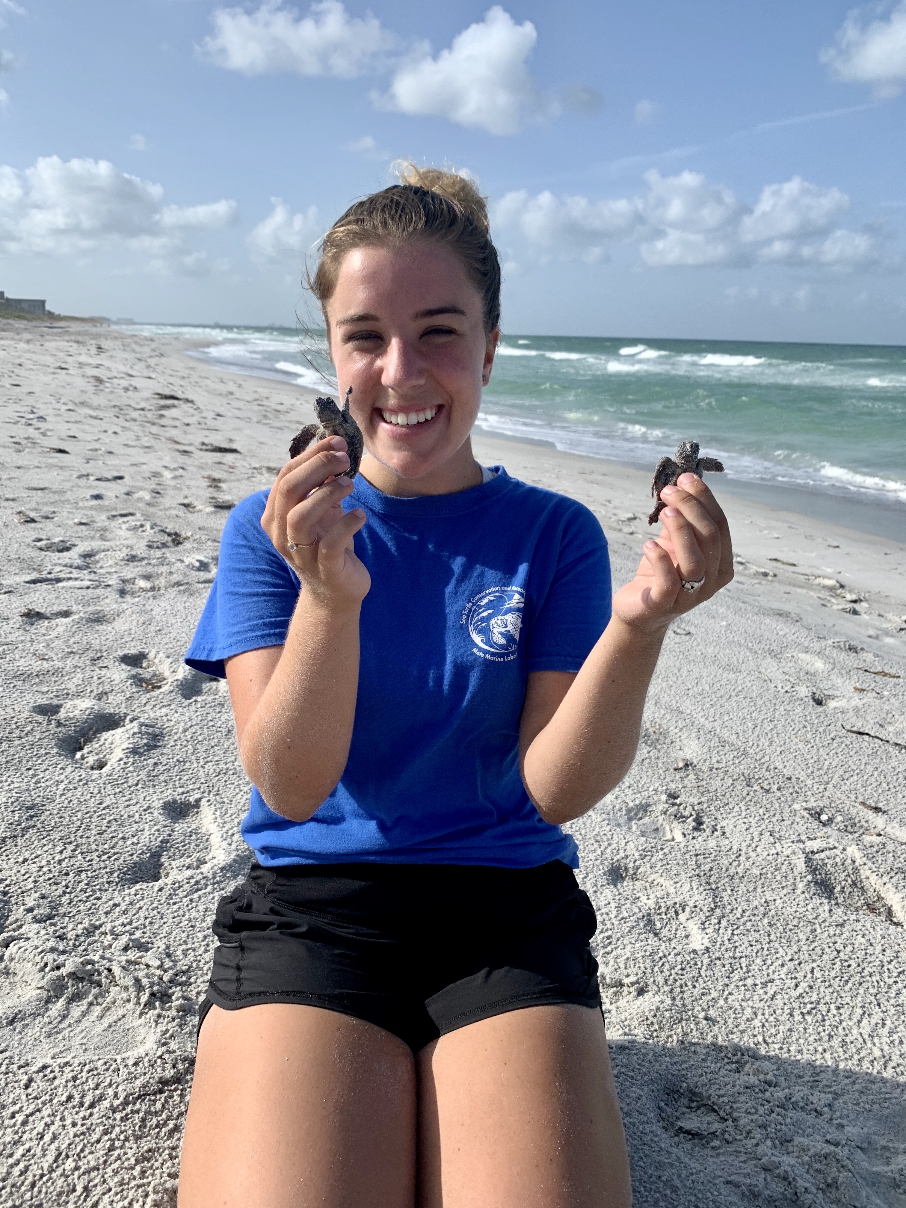 Aileen Lavelle holding a turtle.