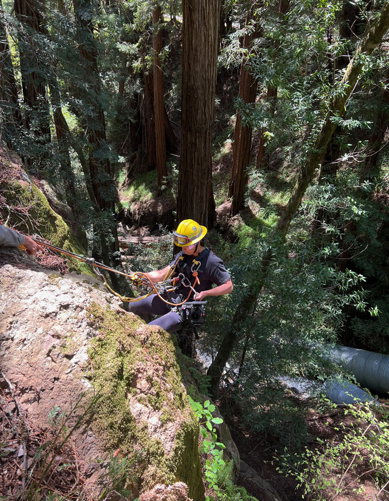 Steven Zeng scaling down a cliff in Marin County while also filming a shot