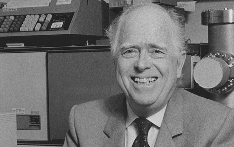 Headshot of Professor John Casida sitting in a lab