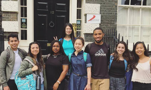 A group of students pose in front of a London building