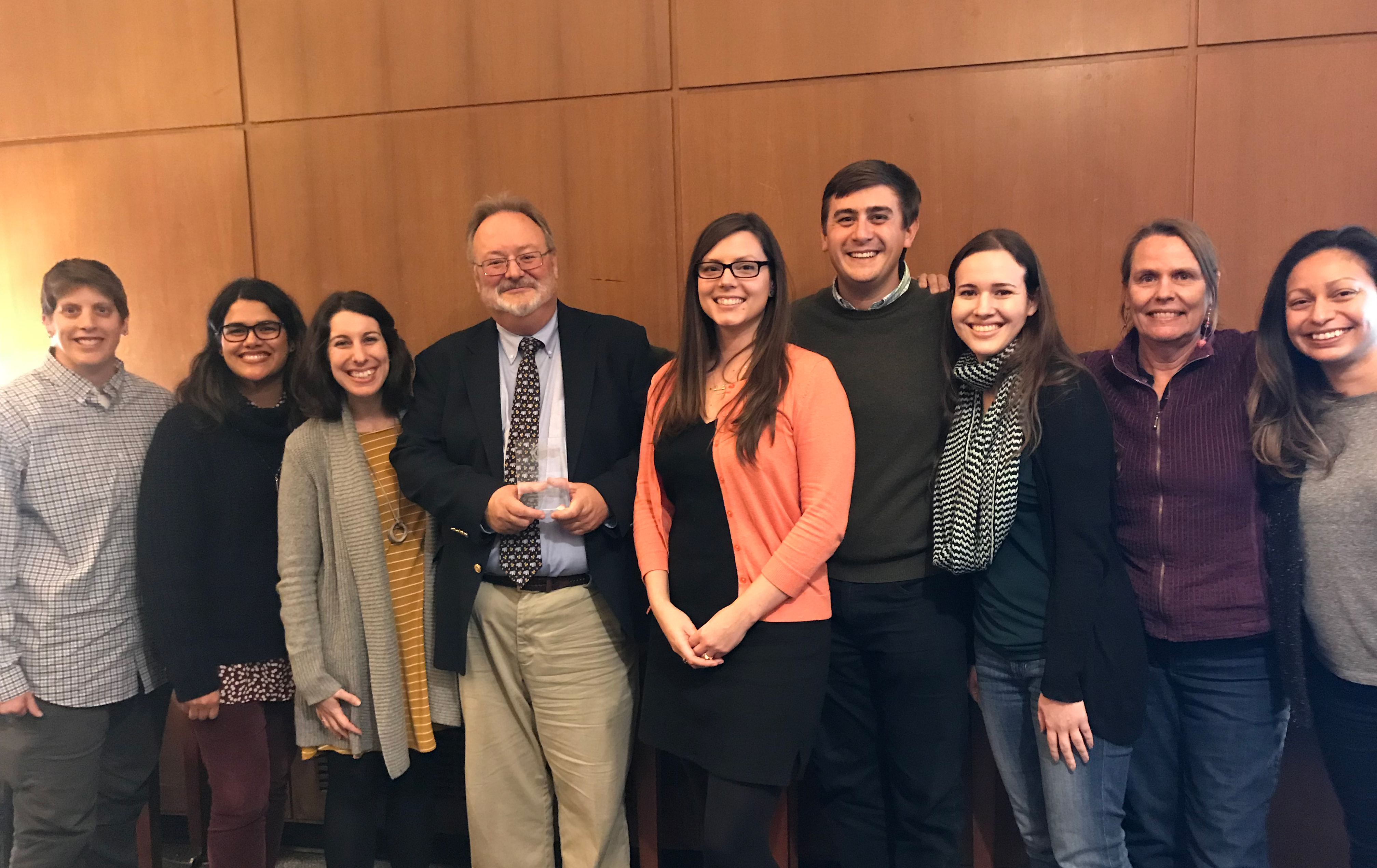 Dean J. Keith Gilless holds his award and stands with CNR advisors