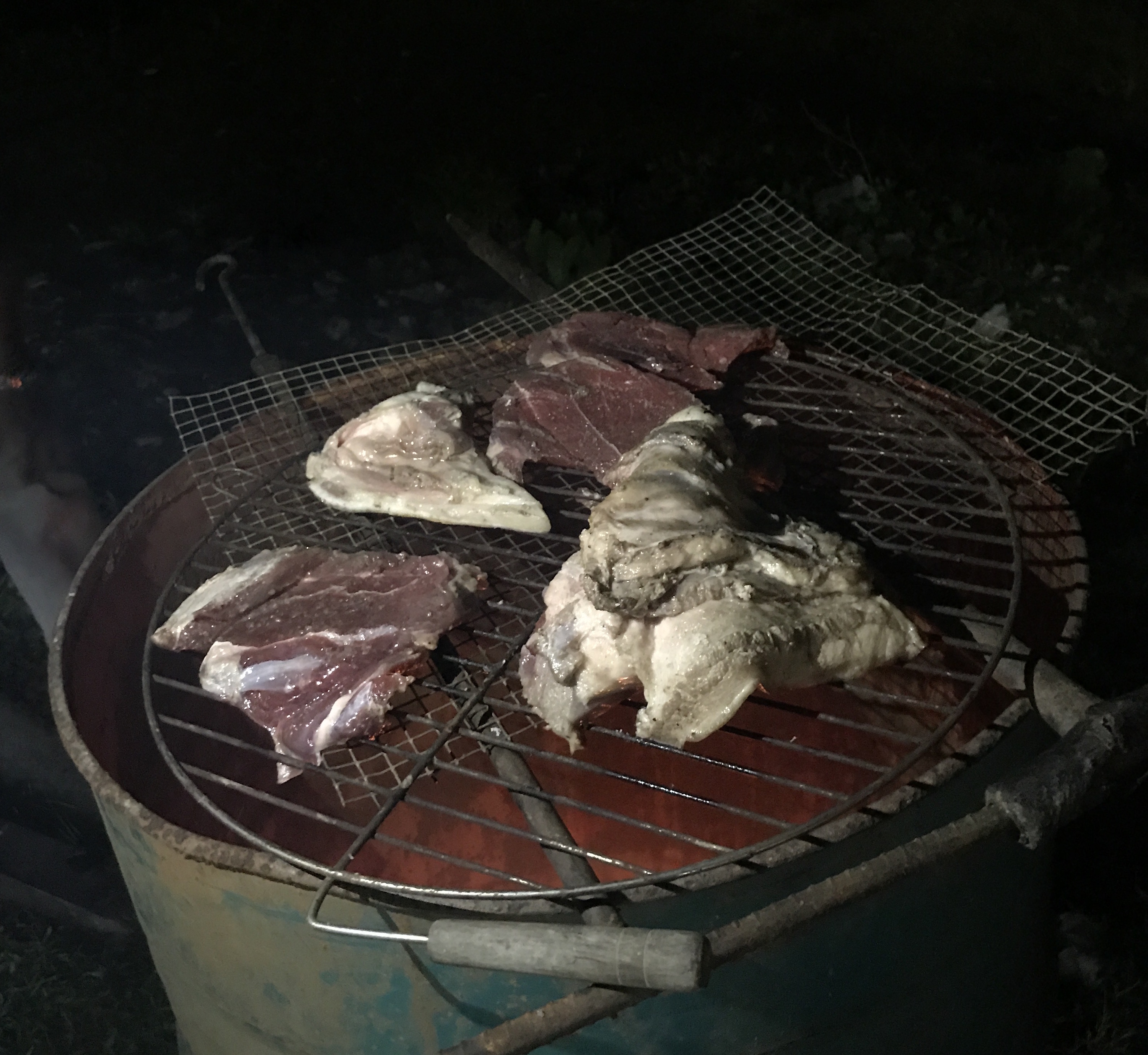 Pig meat on an open barbeque