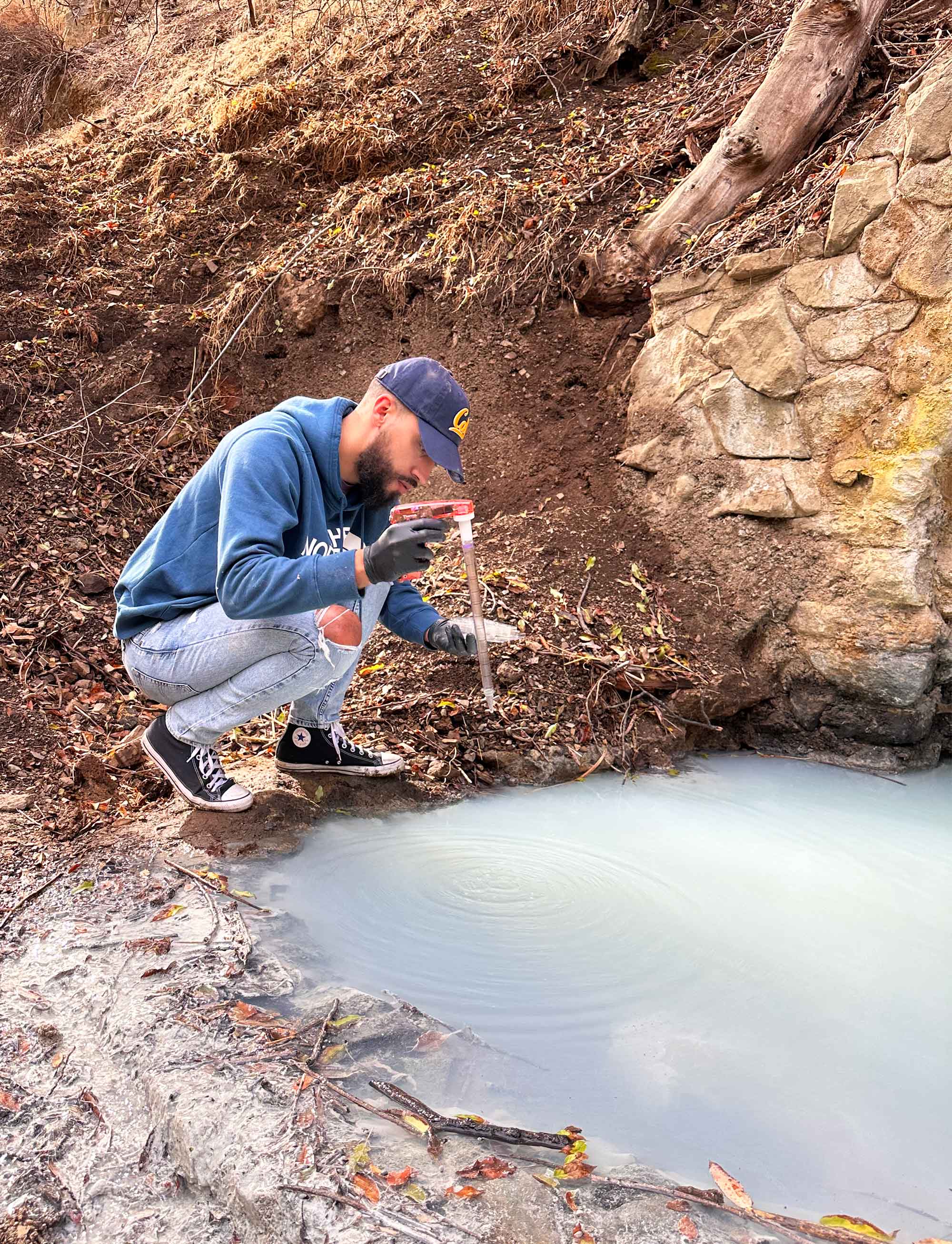 A student sampling water