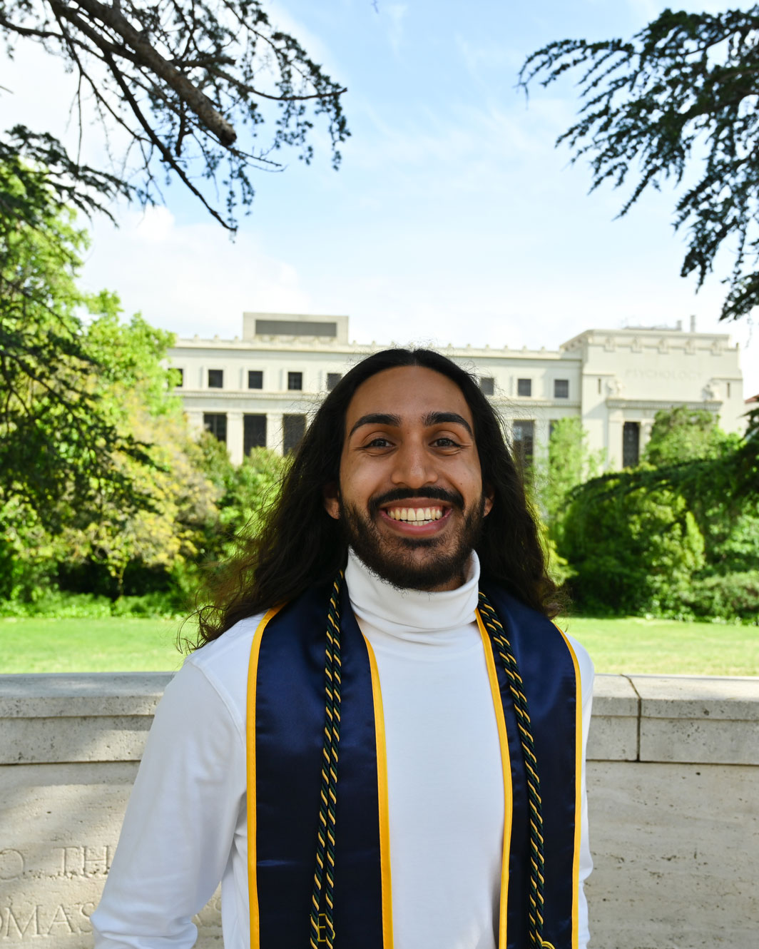 A graduation photo of Wanees Hannan on the UC Berkeley campus.