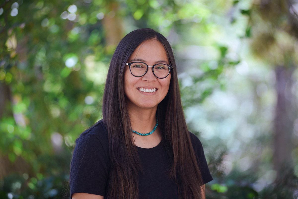 A photo of a woman smiling at the camera