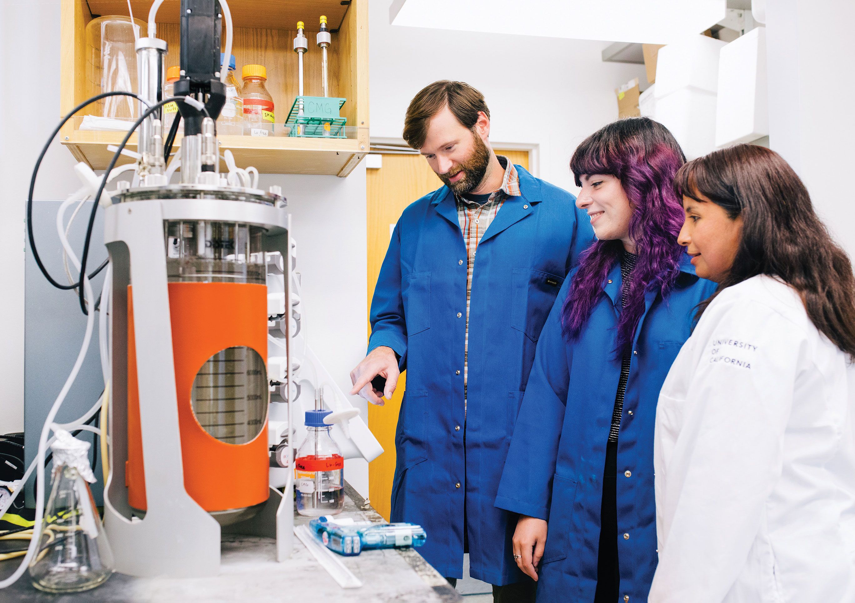 Three researchers in a lab