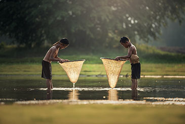 young boys fishing in Thailand