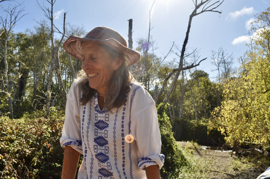 Photo of a woman in a garden. 