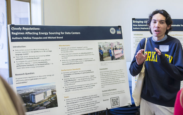 Image of Michael Brand presenting his poster.