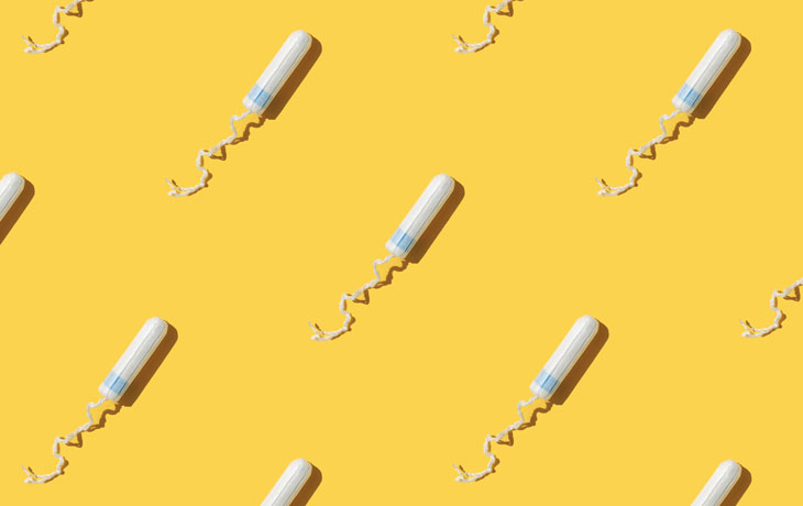Tampons spaced out against yellow colored backdrop