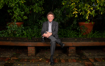 Gordon Rausser sitting in garden