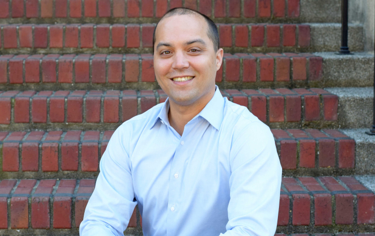 A smiling photo of James Olazmann. 