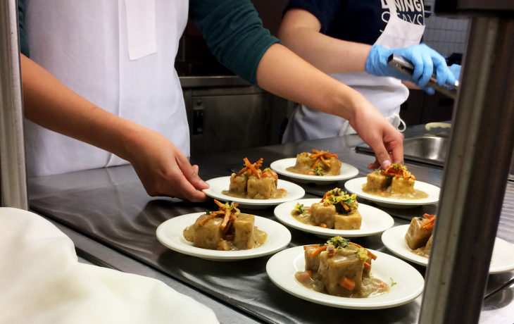 Healthy dishes being served in a cafeteria
