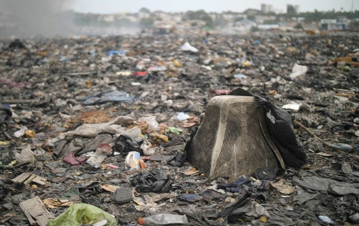 Closeup shot of abandoned trash on a polluted sea shore in Accra, Ghana