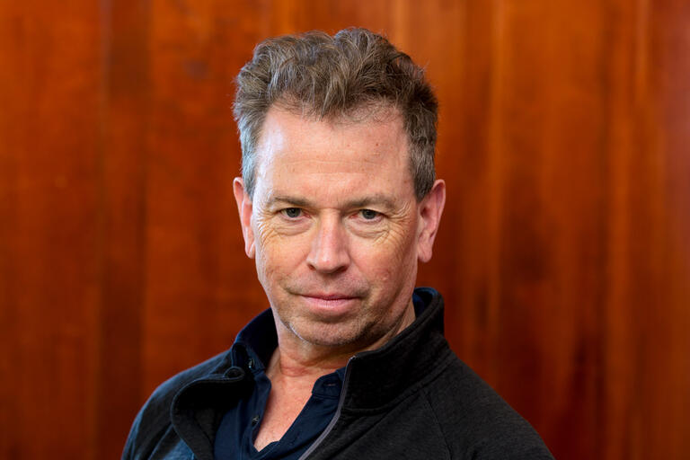 A headshot of Tom Lloyd