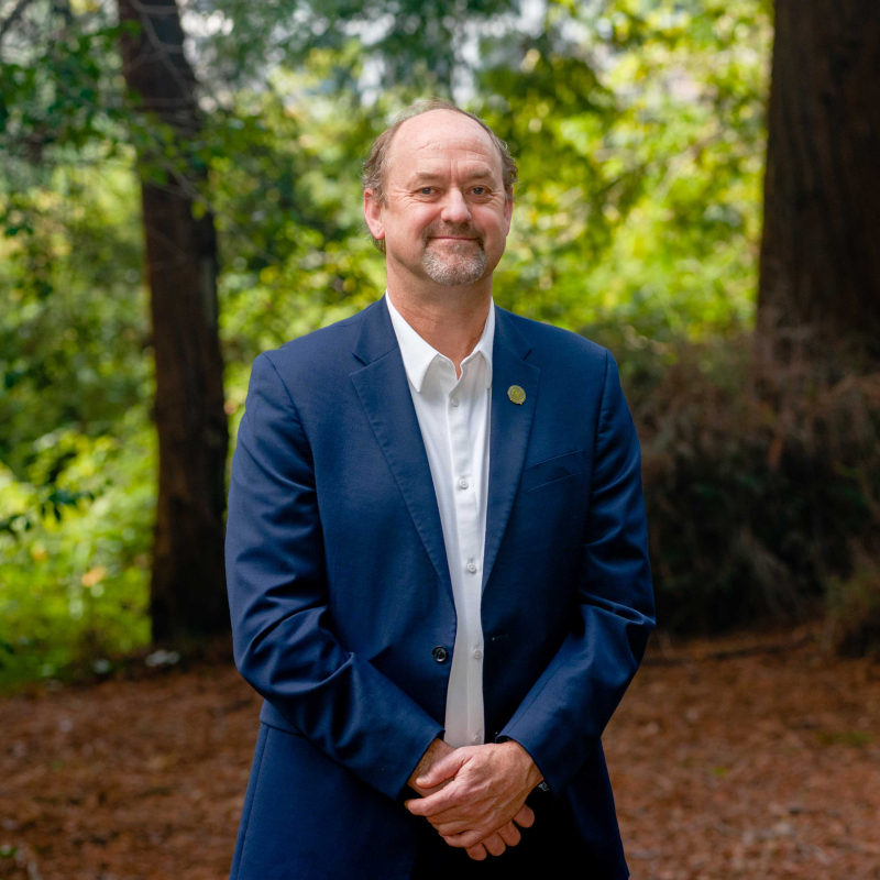 David Ackerly standing in a forest