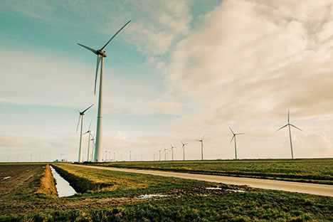 Photo of windmills on a hill.